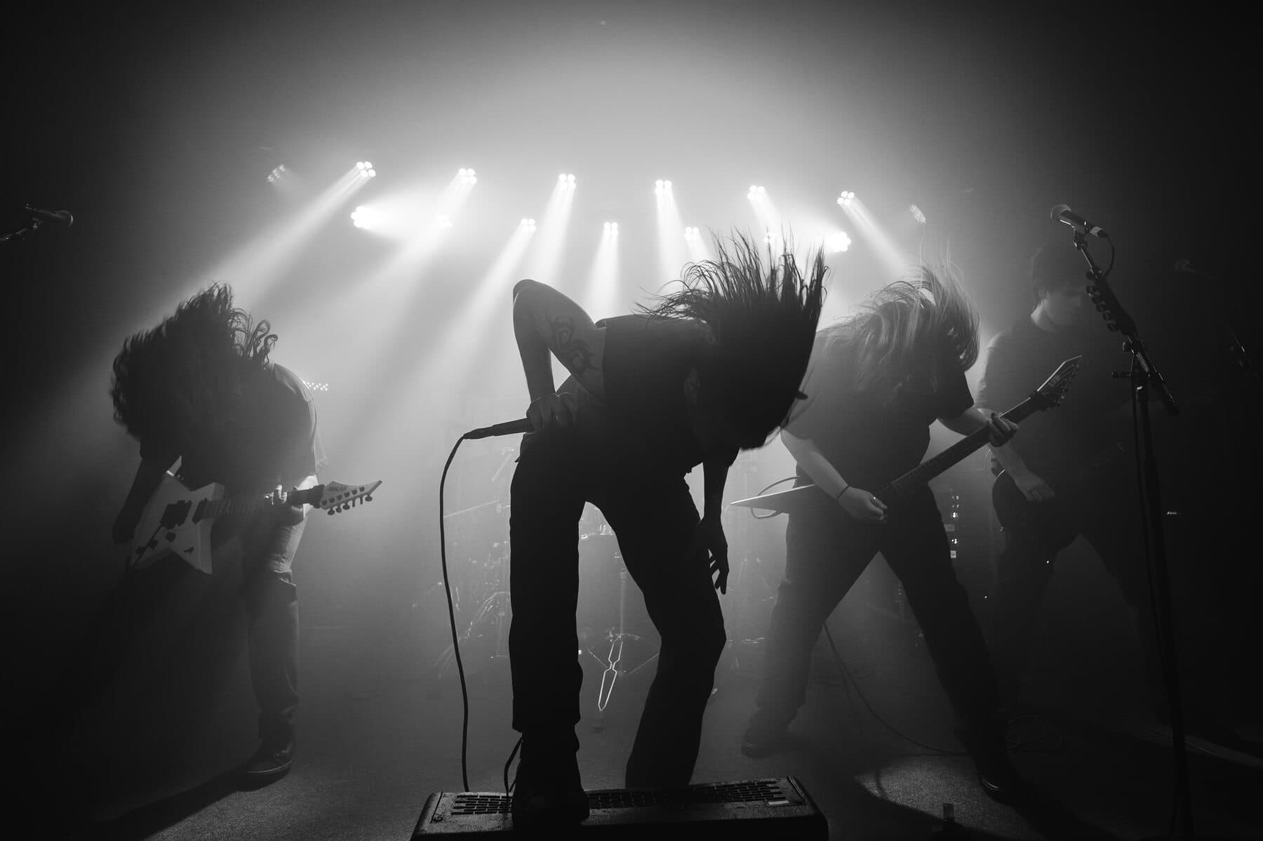 The Overthrone live, the band mid-headbang under stage lights